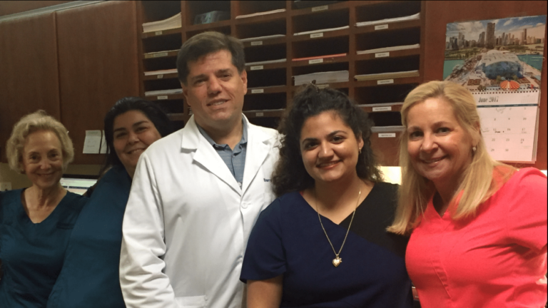 Dr. Barry Schechter and some of Florida Eye's amazing staff strike a pose with Palm Beach State Ophthalmic Tech student Shelby (2nd from right)