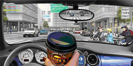demonstrates vision with the Trifocal Lens, you can see the coffee cup up close, the dashboard at intermediate, as well as road signs in the distance — all clearly.